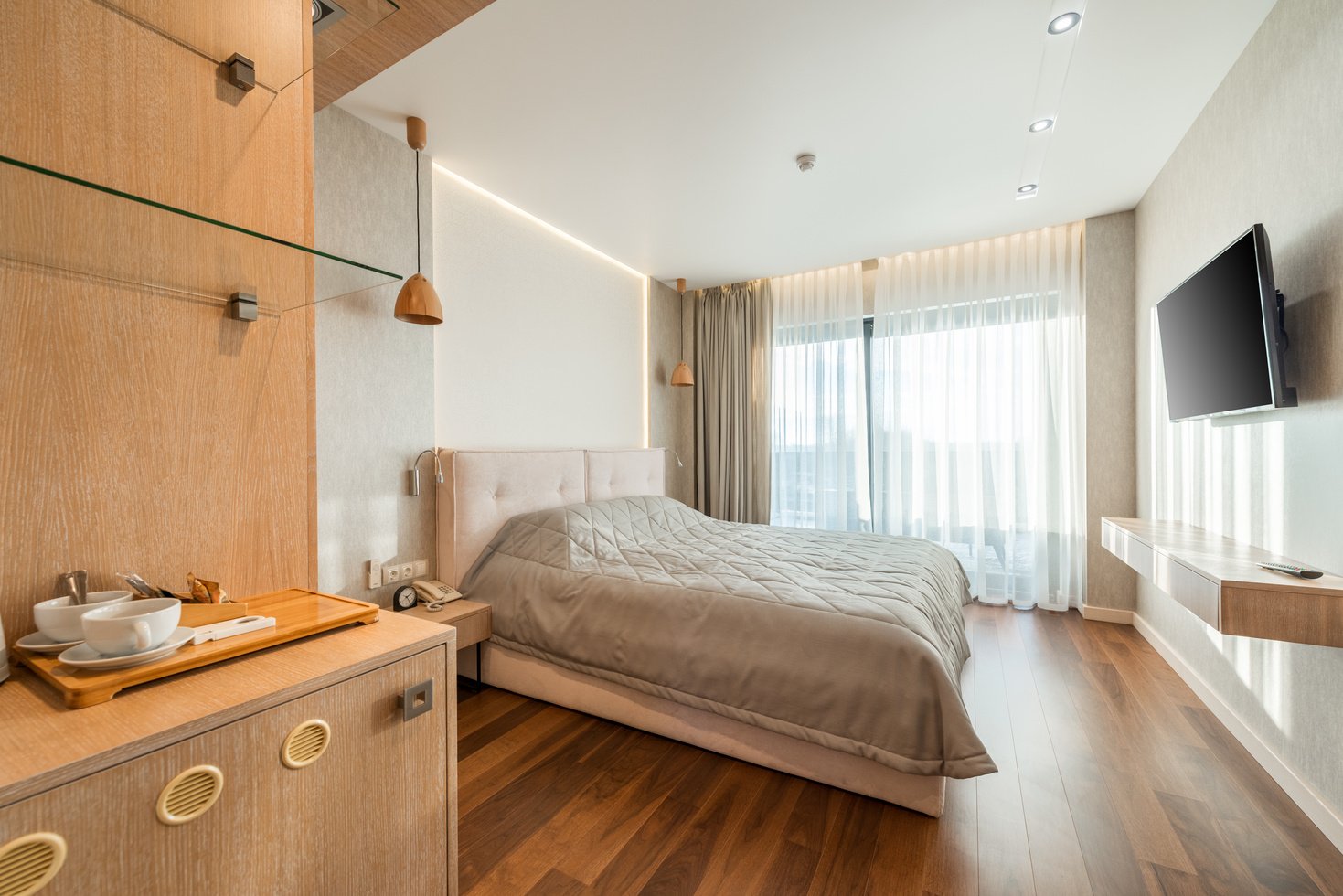 Bed with TV set in hotel room